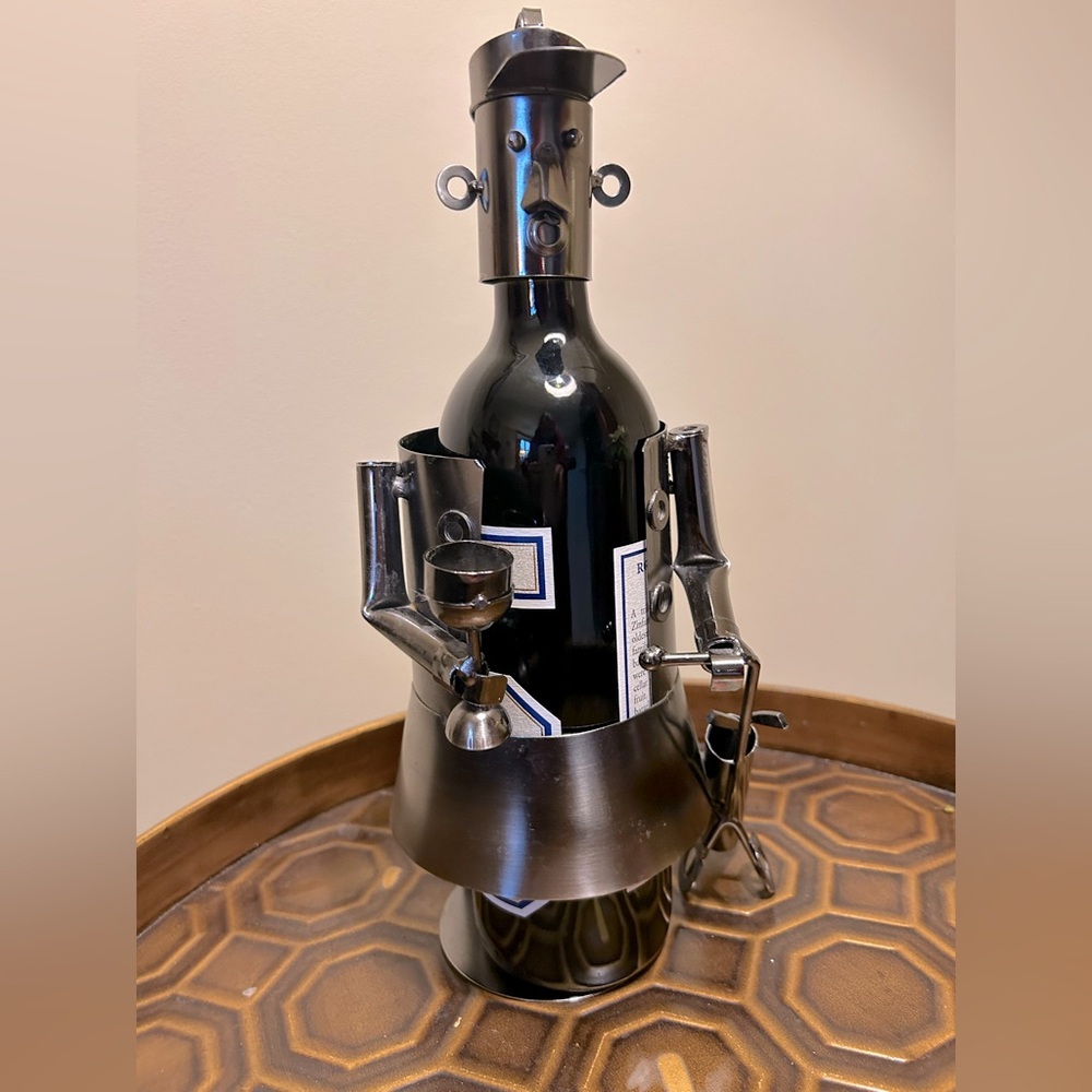 Dark silver metal golfer wine holder . WINE NOT INCLUDED